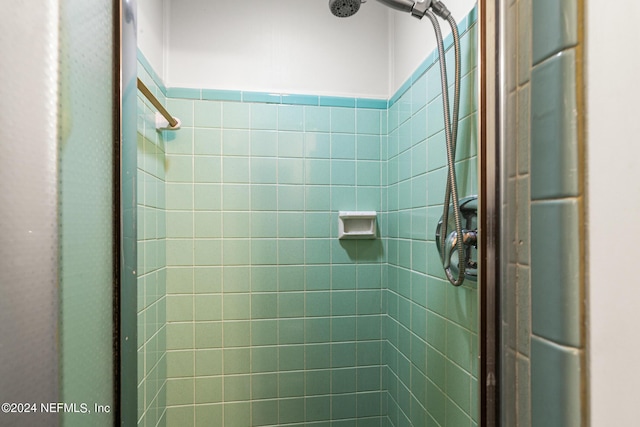 bathroom with tiled shower