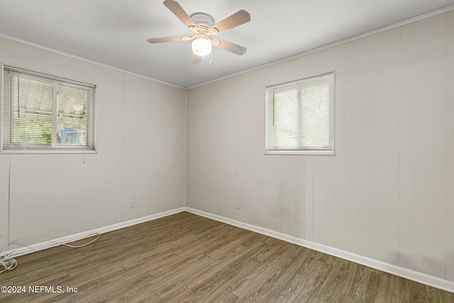 unfurnished room with crown molding, hardwood / wood-style flooring, and ceiling fan