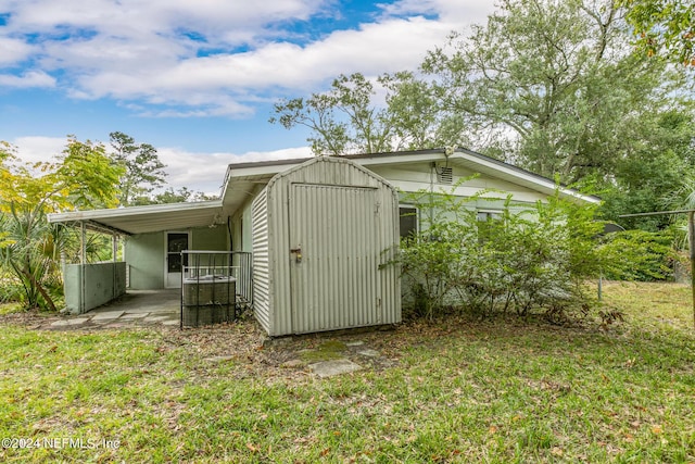 view of outbuilding with a lawn