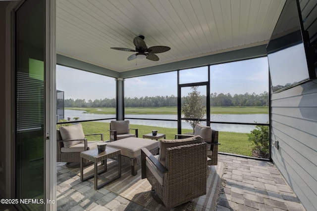 sunroom / solarium with ceiling fan and wood ceiling