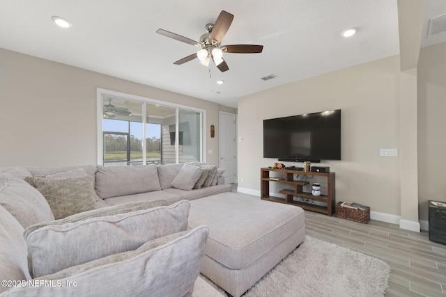 living room featuring ceiling fan