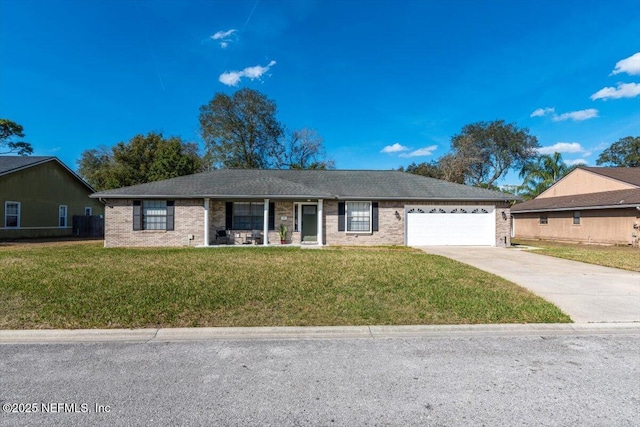 ranch-style home with a garage and a front lawn