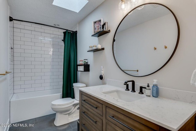 full bathroom with a skylight, vanity, toilet, shower / bath combo, and a textured ceiling