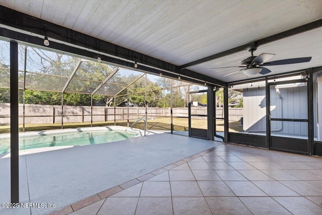 view of pool featuring a patio, ceiling fan, and glass enclosure