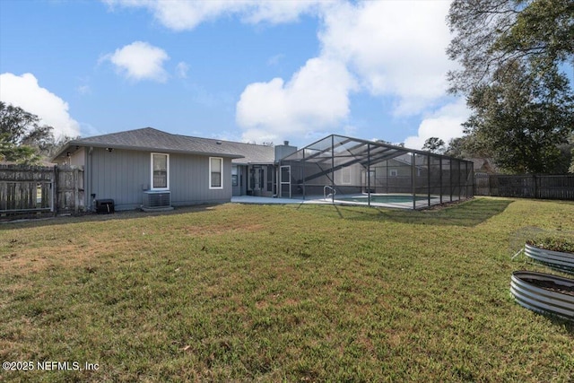 view of yard with a fenced in pool, a lanai, central AC, and a patio