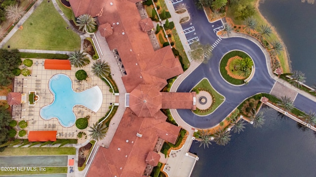 birds eye view of property featuring a water view