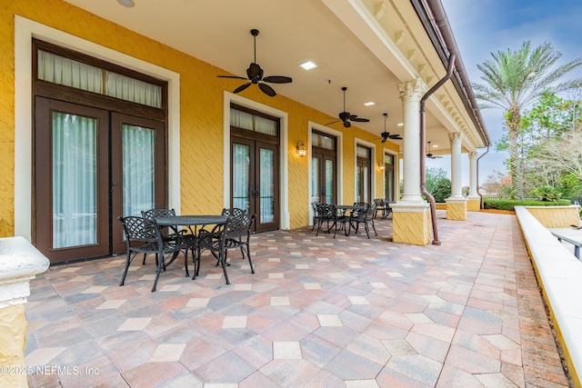 view of patio featuring ceiling fan and french doors