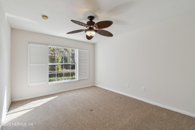 carpeted empty room featuring ceiling fan