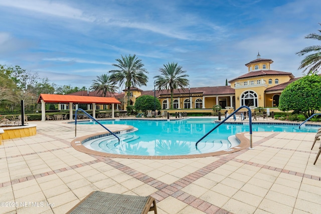 view of swimming pool with a gazebo and a patio area