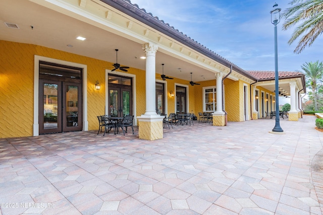 view of patio featuring french doors and ceiling fan