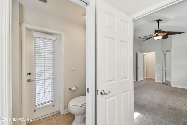 bathroom featuring tile patterned floors, ceiling fan, and toilet