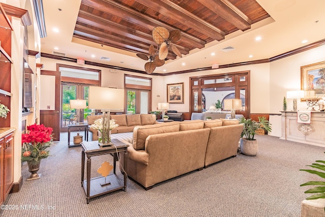 living room featuring crown molding, wood ceiling, beamed ceiling, and carpet