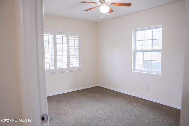 spare room featuring carpet floors and ceiling fan