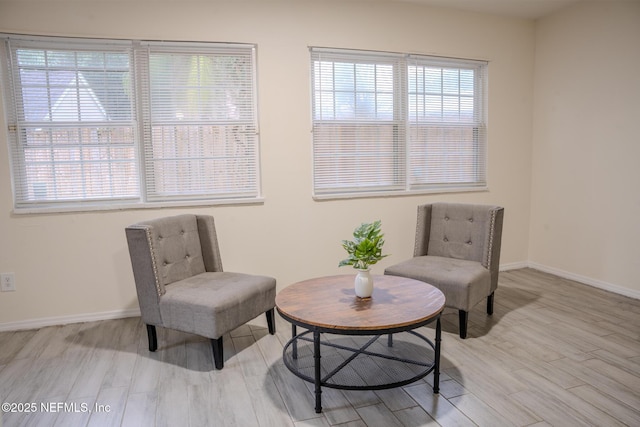 sitting room with light hardwood / wood-style floors