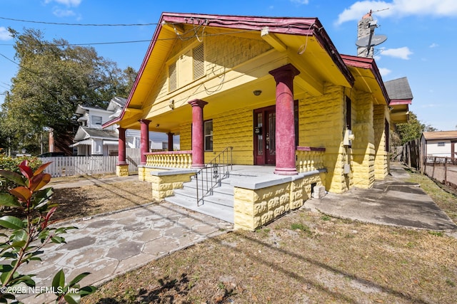 view of side of property with a porch