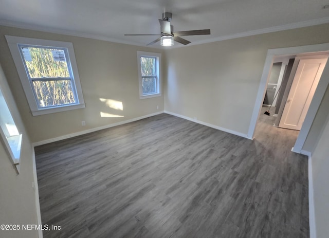 empty room with crown molding, ceiling fan, and dark hardwood / wood-style flooring