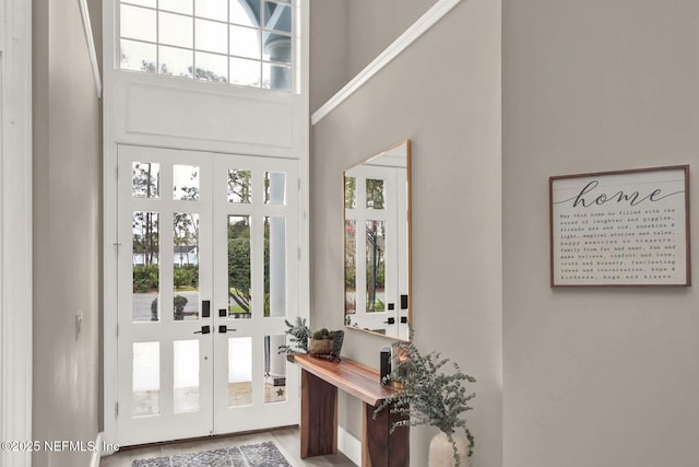 entryway with a towering ceiling