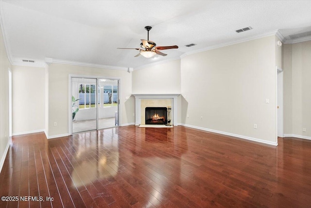 unfurnished living room with ceiling fan, hardwood / wood-style flooring, and crown molding