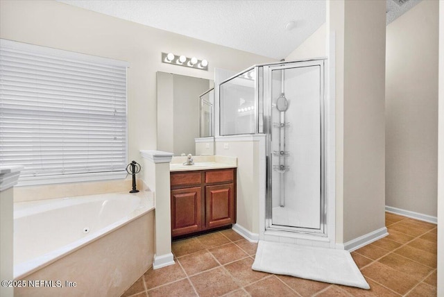 bathroom with separate shower and tub, a textured ceiling, tile patterned flooring, and vanity