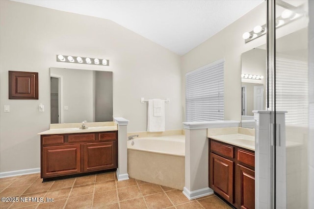 bathroom featuring tile patterned floors, separate shower and tub, lofted ceiling, and vanity