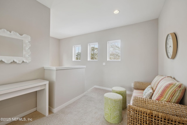 living area with recessed lighting, carpet, an upstairs landing, and baseboards