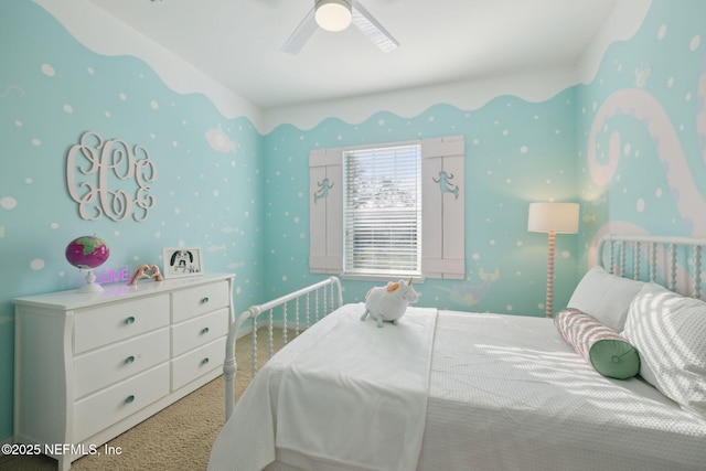 bedroom with ceiling fan and wallpapered walls