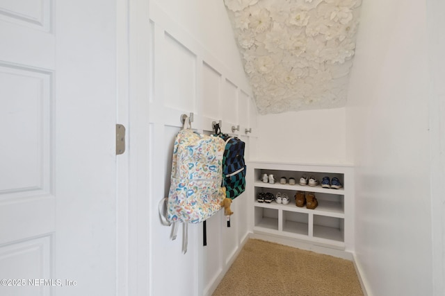 mudroom with lofted ceiling