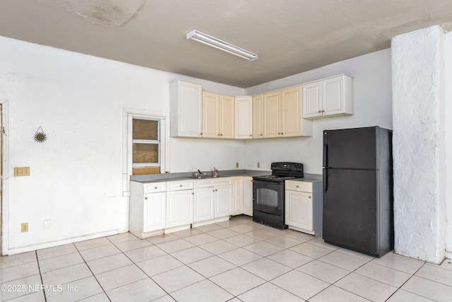 1360 Hart St, Jacksonville, FL 32209 - kitchen with light tile patterned floors, a sink, and black appliances