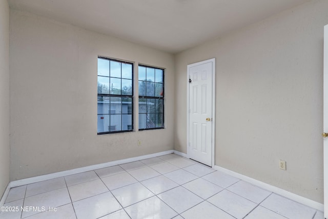 1360 Hart St, Jacksonville, FL 32209 - empty room with light tile patterned flooring and baseboards