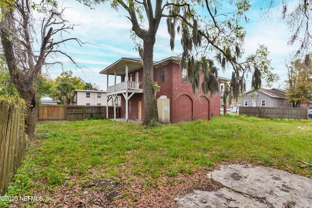 1360 Hart St, Jacksonville, FL 32209 - exterior space with a fenced backyard, a balcony, and a yard