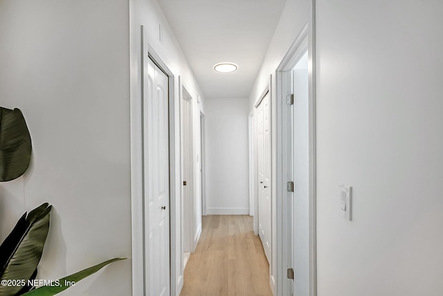 hallway with light wood-type flooring