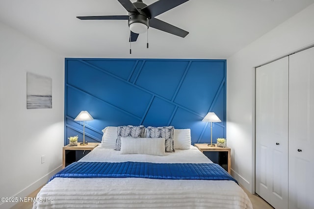 bedroom with ceiling fan and a closet