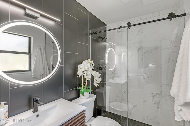 bathroom with toilet, vanity, and walk in shower