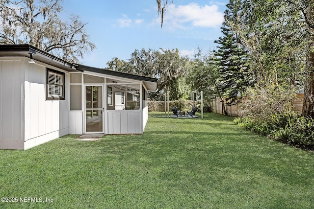 view of yard with a sunroom