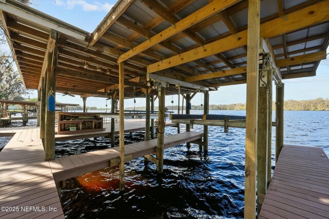 view of dock with a water view