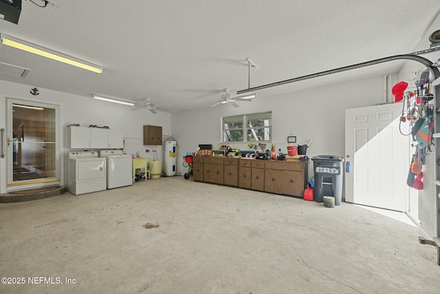 garage featuring washer and clothes dryer, electric water heater, and ceiling fan