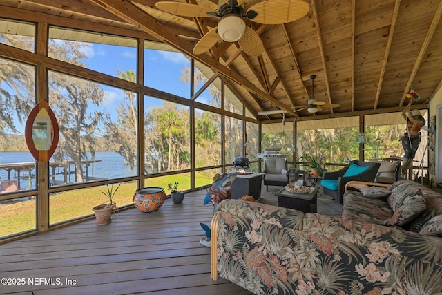 sunroom featuring lofted ceiling with beams, a water view, wooden ceiling, and ceiling fan