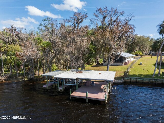 dock area featuring a water view and a yard