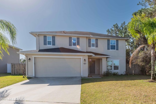 view of front property with a garage and a front yard