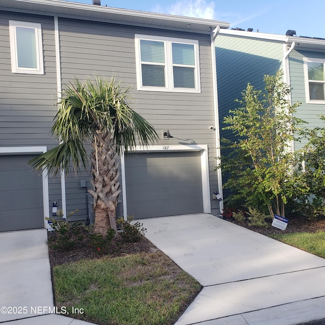 11107 Quasar Ct, Jacksonville, FL 32256 - view of front facade with driveway and a garage