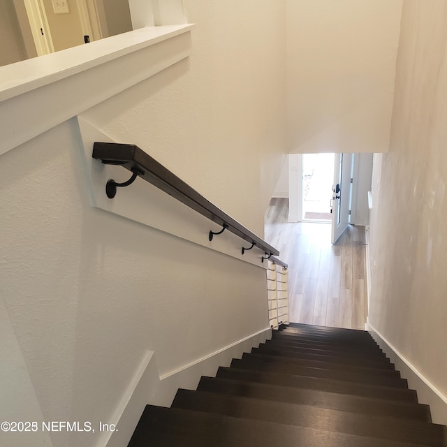 11107 Quasar Ct, Jacksonville, FL 32256 - stairway with baseboards and wood finished floors
