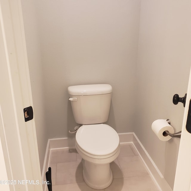 11107 Quasar Ct, Jacksonville, FL 32256 - bathroom featuring baseboards, tile patterned flooring, and toilet