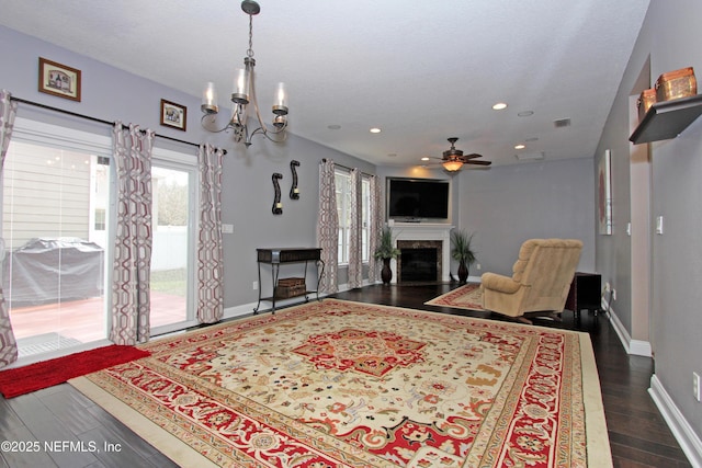 bedroom with multiple windows, dark wood-type flooring, access to outside, and an inviting chandelier