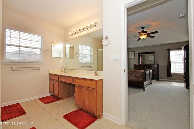 bathroom with vanity, tile patterned floors, ceiling fan, and a shower with shower door