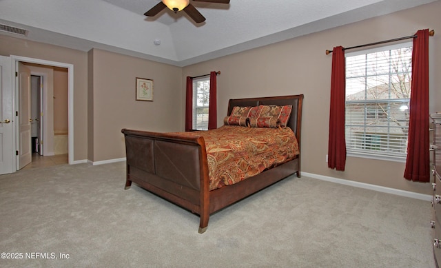 bedroom with vaulted ceiling, light colored carpet, and ceiling fan