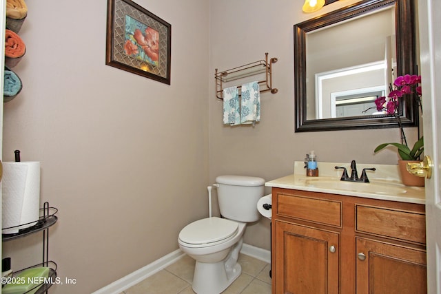 bathroom with vanity, tile patterned floors, and toilet