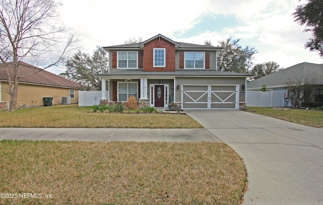 view of front of property with a garage, central air condition unit, and a front lawn