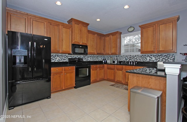 kitchen with backsplash, light tile patterned floors, and black appliances