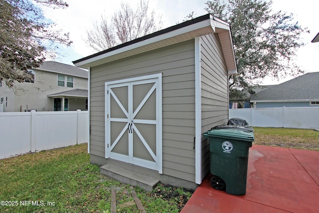 view of outdoor structure with a lawn