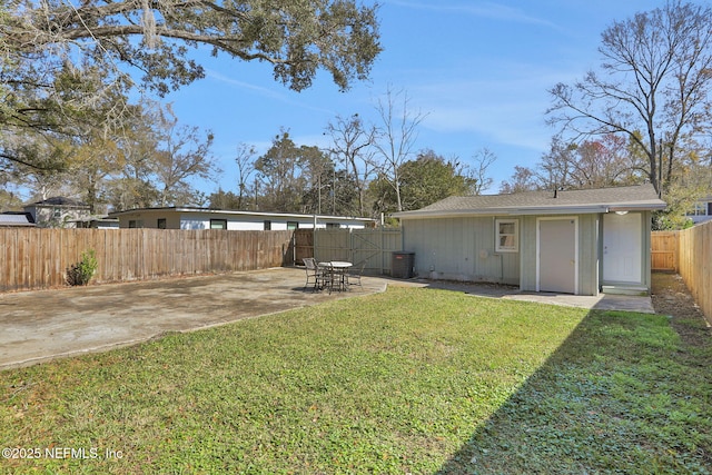 view of yard with a patio and central air condition unit